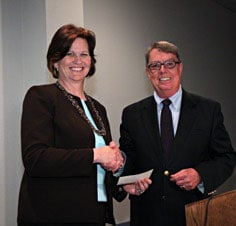 Mr. Milham is pictured here, in 2010, presenting a $50,000 check to Katherine S. Ankerson, associate dean of University of Nebraska at Lincoln’s College of Architecture and professor in the Interior Design program